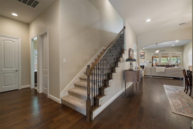 stairs featuring ceiling fan, wood-type flooring, recessed lighting, and visible vents