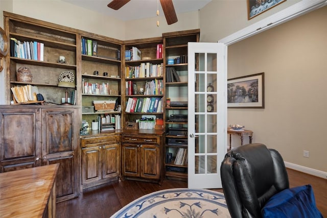 home office featuring baseboards, dark wood finished floors, and ceiling fan
