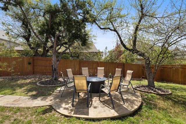 view of patio / terrace featuring outdoor dining area and a fenced backyard