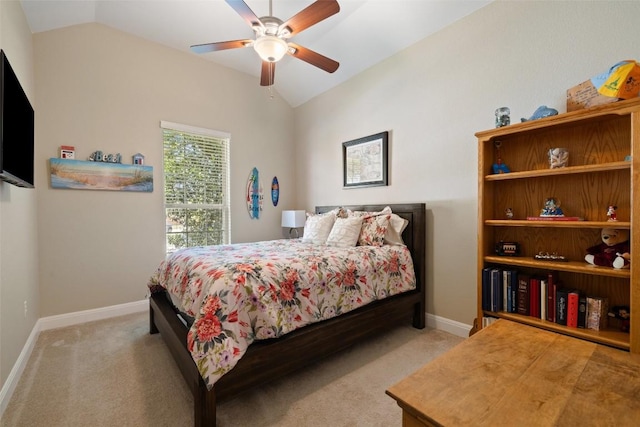 bedroom with baseboards, vaulted ceiling, and light colored carpet