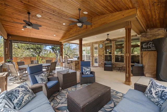 view of patio featuring fence, outdoor lounge area, a ceiling fan, and outdoor dining area