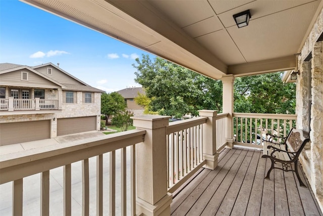 wooden deck with a garage
