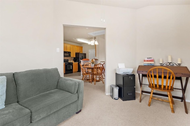office area with baseboards, attic access, and light carpet