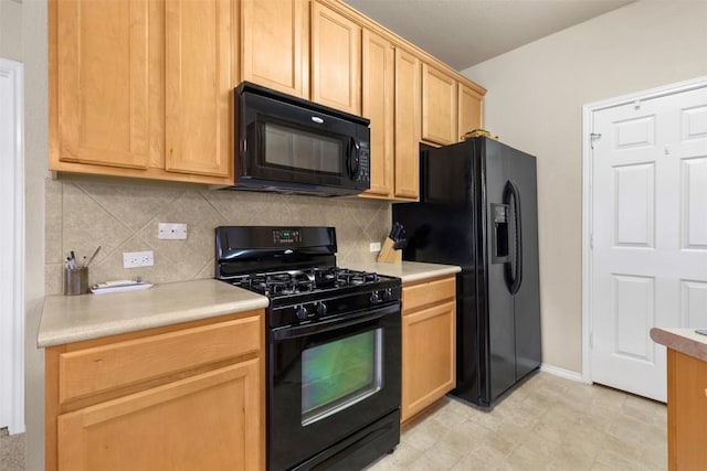 kitchen with light countertops, decorative backsplash, black appliances, and light brown cabinets
