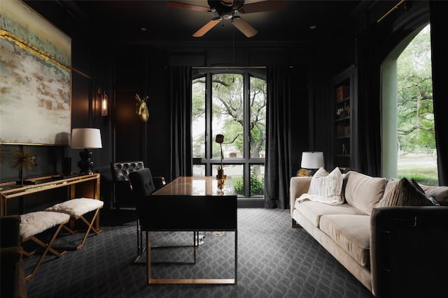 office space with ornamental molding, carpet, ceiling fan, and a wealth of natural light