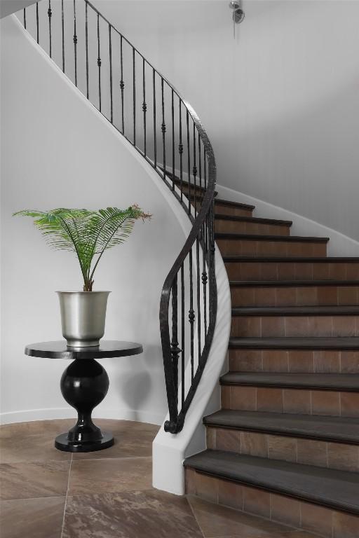 stairway featuring baseboards