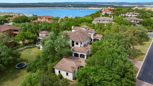 drone / aerial view with a residential view and a water view