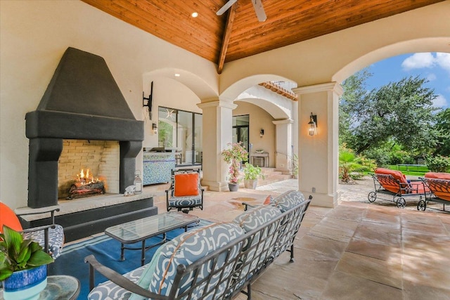 201 Costa Bella Dr, Austin, TX 78734 - view of patio / terrace featuring an outdoor living space with a fireplace and ceiling fan