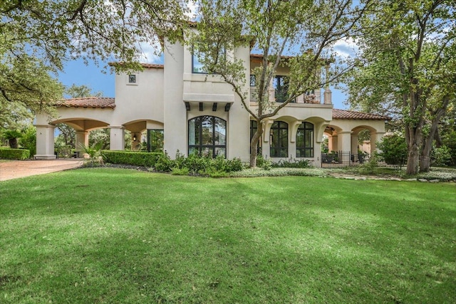 201 Costa Bella Dr, Austin, TX 78734 - mediterranean / spanish home with a front yard, stucco siding, and a tiled roof