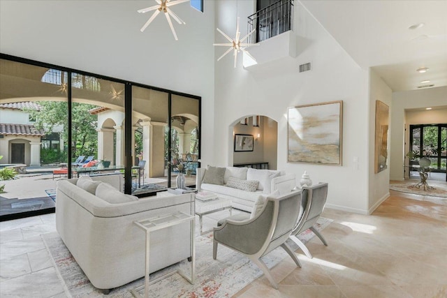 201 Costa Bella Dr, Austin, TX 78734 - living room featuring a towering ceiling and arched walkways