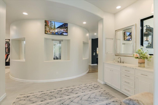 201 Costa Bella Dr, Austin, TX 78734 - bathroom with vanity, tile patterned floors, and recessed lighting