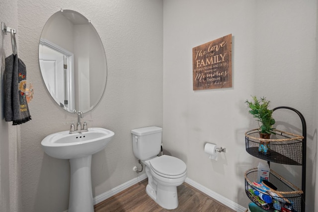 17418 Gabbro Dr, Pflugerville, TX 78660 - bathroom featuring wood finished floors, toilet, and baseboards