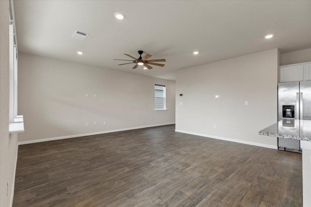 unfurnished living room with visible vents, baseboards, ceiling fan, recessed lighting, and dark wood-type flooring