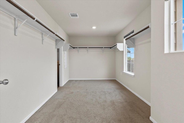 walk in closet with carpet flooring and visible vents