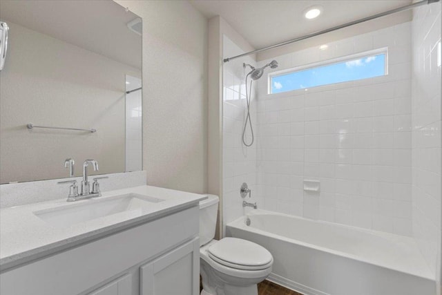 full bath featuring vanity, toilet, and tub / shower combination