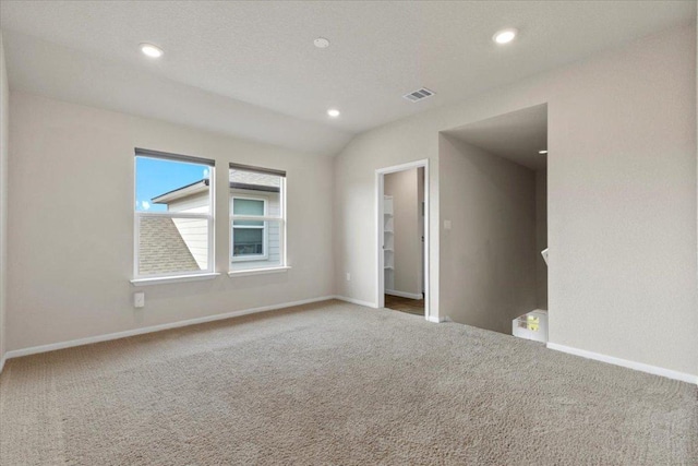 empty room featuring baseboards, carpet flooring, recessed lighting, and visible vents