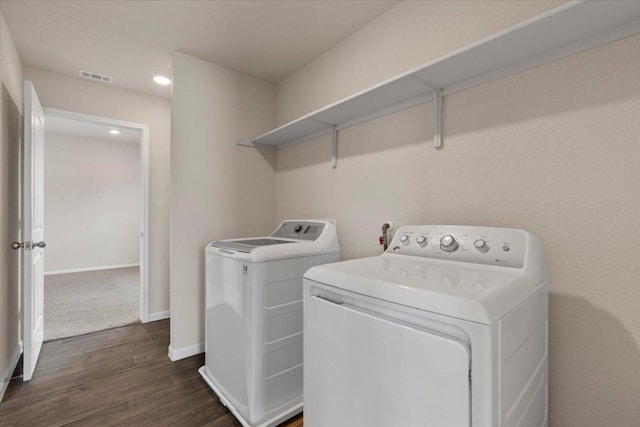 clothes washing area featuring dark wood-style flooring, recessed lighting, baseboards, visible vents, and washer and clothes dryer