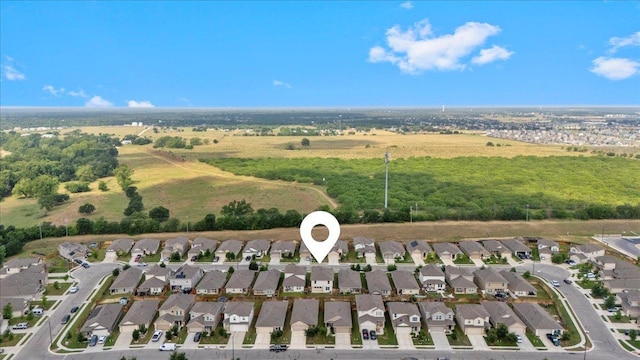birds eye view of property with a residential view