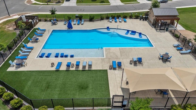 view of pool featuring fence