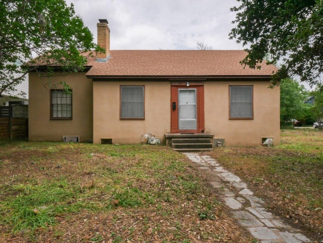 810 E 45th St, Austin, TX 78751 - view of front of home featuring a shingled roof, stucco siding, and a chimney
