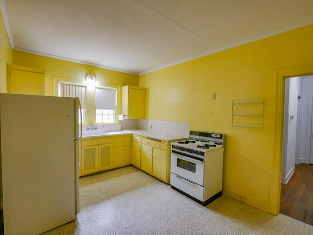 810 E 45th St, Austin, TX 78751 - kitchen featuring baseboards, light countertops, white appliances, and ornamental molding