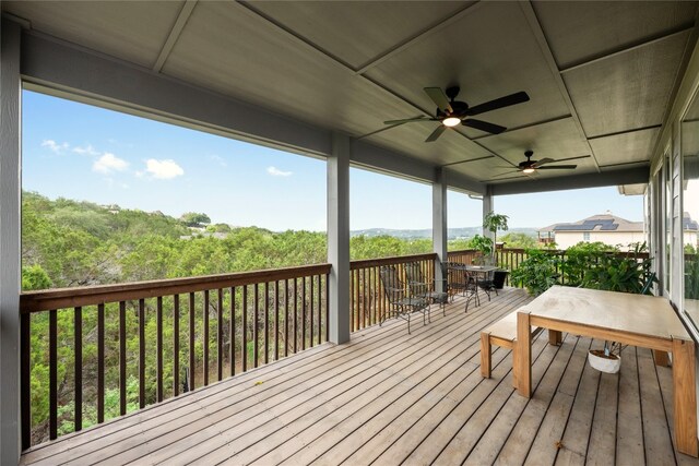 deck with ceiling fan and outdoor dining space