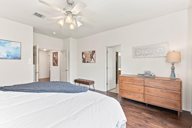 bedroom featuring dark wood-style flooring, baseboards, and visible vents