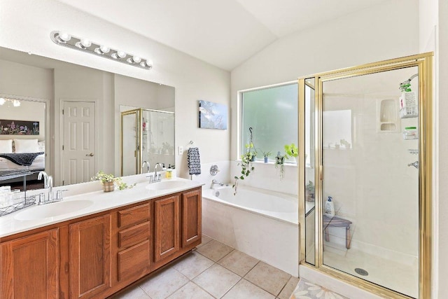 ensuite bathroom featuring a garden tub, a shower stall, a sink, tile patterned floors, and ensuite bathroom