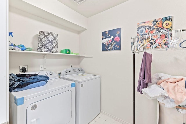 washroom with laundry area and washing machine and dryer