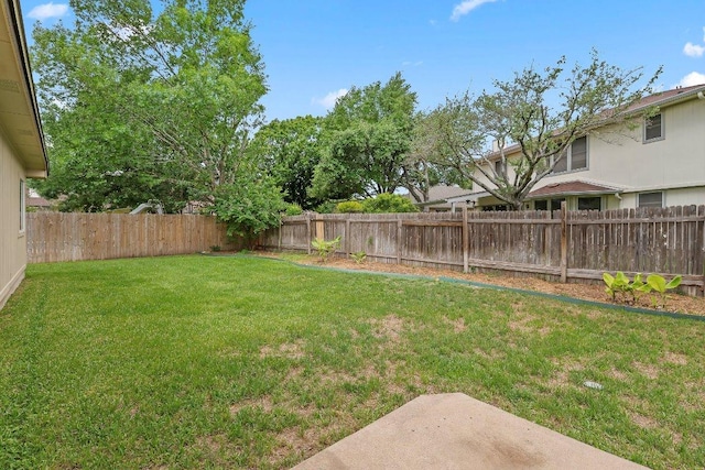 view of yard featuring a fenced backyard