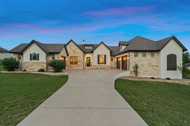 831 Sad Willow Pass, Driftwood, TX 78619 - french country home with a garage, stucco siding, driveway, and stone siding