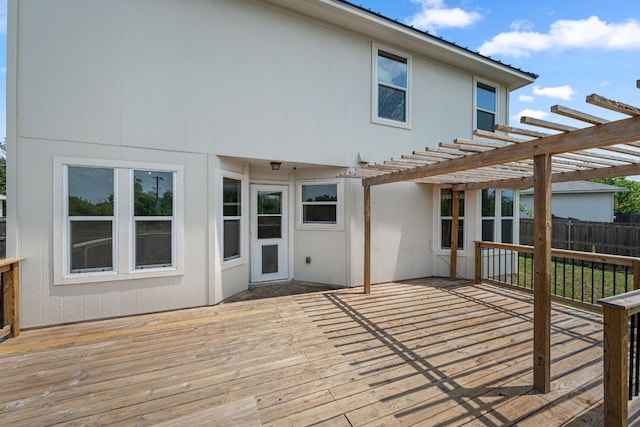 wooden deck with a pergola and fence