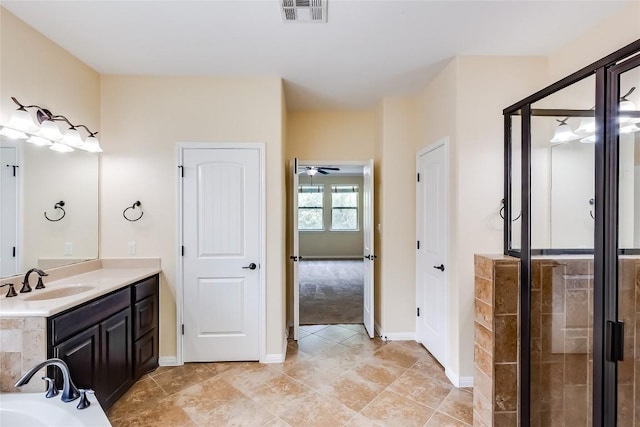 full bath with visible vents, baseboards, and a stall shower