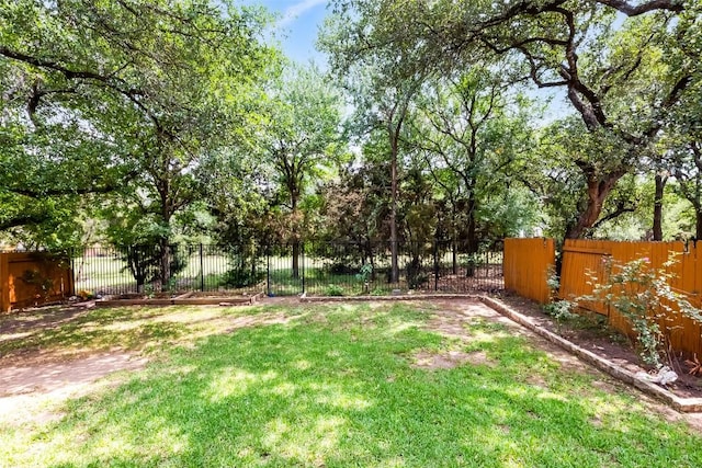 view of yard with a fenced backyard