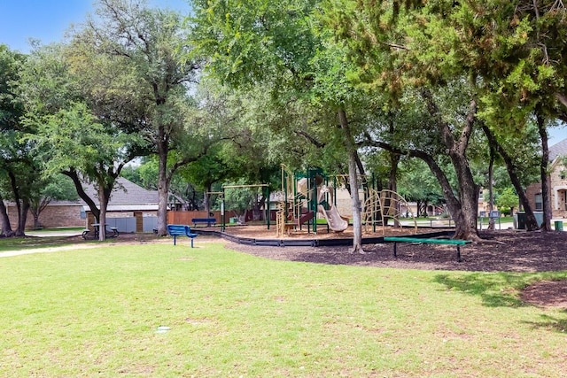 view of community featuring playground community and a yard