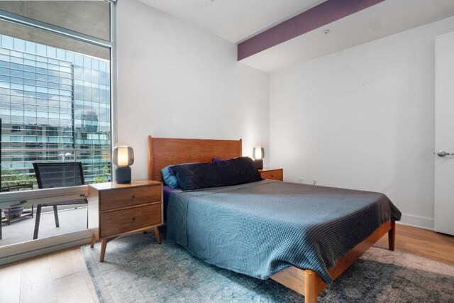bedroom with wood finished floors
