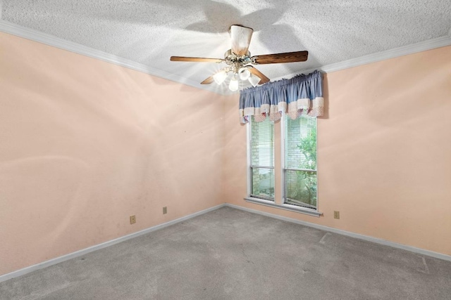 carpeted spare room featuring a ceiling fan, a textured ceiling, and ornamental molding