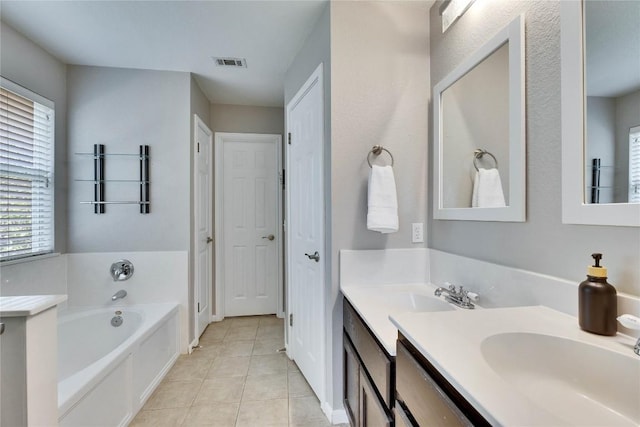3957 Canyon Glen Cir, Austin, TX 78732 - bathroom featuring a bath, tile patterned flooring, double vanity, and plenty of natural light
