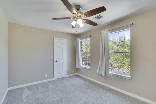 3957 Canyon Glen Cir, Austin, TX 78732 - unfurnished room with ceiling fan and carpet flooring