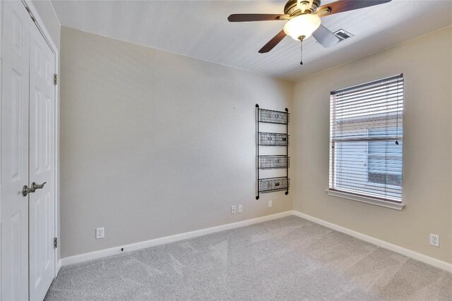 3957 Canyon Glen Cir, Austin, TX 78732 - empty room with carpet floors and a ceiling fan