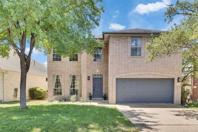 3957 Canyon Glen Cir, Austin, TX 78732 - view of front of property featuring driveway, a front lawn, brick siding, and an attached garage