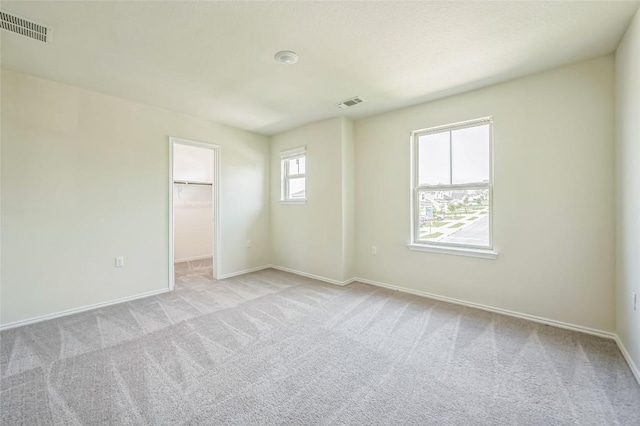10401 American Paint Way, Manor, TX 78653 - empty room with light carpet and baseboards