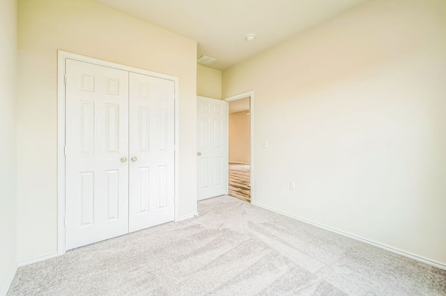 10401 American Paint Way, Manor, TX 78653 - unfurnished bedroom featuring a closet, carpet, and baseboards