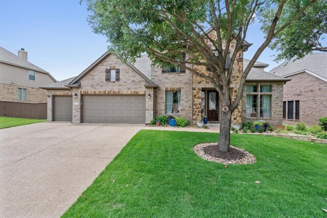 3912 Walsh Ranch Blvd, Round Rock, TX 78681 - view of front facade featuring a front lawn, concrete driveway, and brick siding