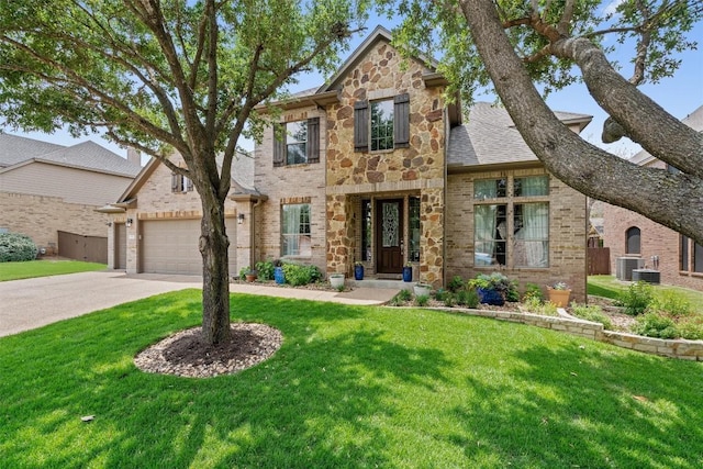3912 Walsh Ranch Blvd, Round Rock, TX 78681 - view of front facade featuring concrete driveway, a front yard, stone siding, and brick siding