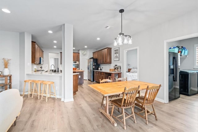 3912 Walsh Ranch Blvd, Round Rock, TX 78681 - dining space featuring light wood-style floors and recessed lighting