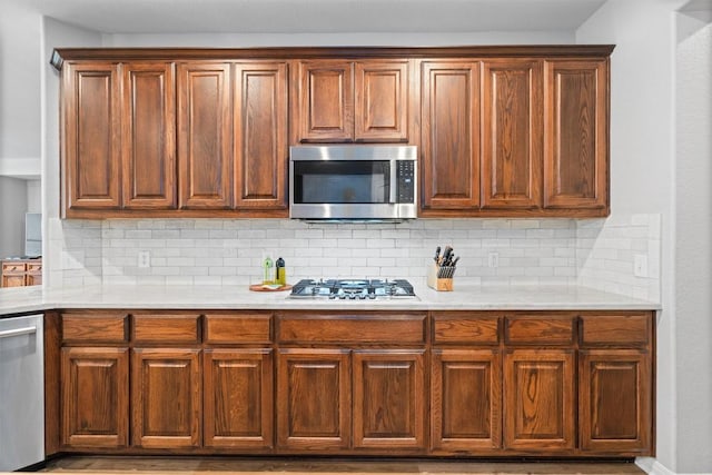 3912 Walsh Ranch Blvd, Round Rock, TX 78681 - kitchen featuring appliances with stainless steel finishes, light countertops, and backsplash