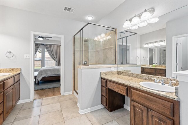 3912 Walsh Ranch Blvd, Round Rock, TX 78681 - ensuite bathroom with a stall shower, two vanities, tile patterned flooring, and a ceiling fan