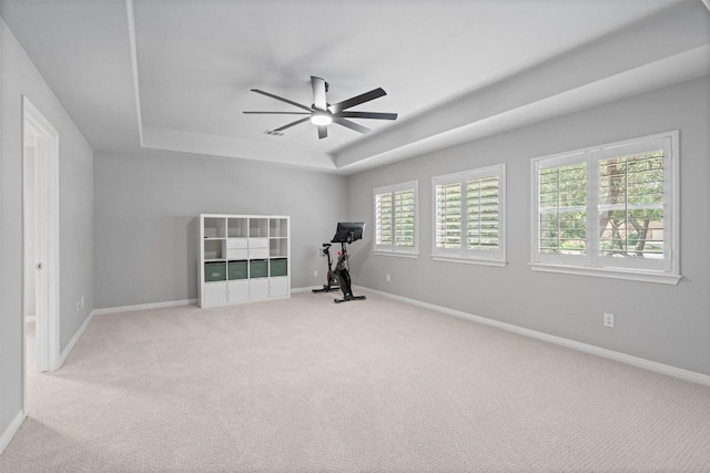 3912 Walsh Ranch Blvd, Round Rock, TX 78681 - exercise room with a tray ceiling, a ceiling fan, and light colored carpet