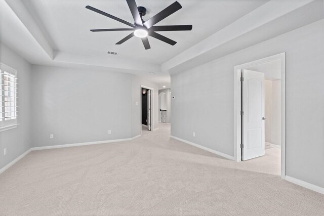 3912 Walsh Ranch Blvd, Round Rock, TX 78681 - unfurnished room featuring light colored carpet, ceiling fan, and a tray ceiling